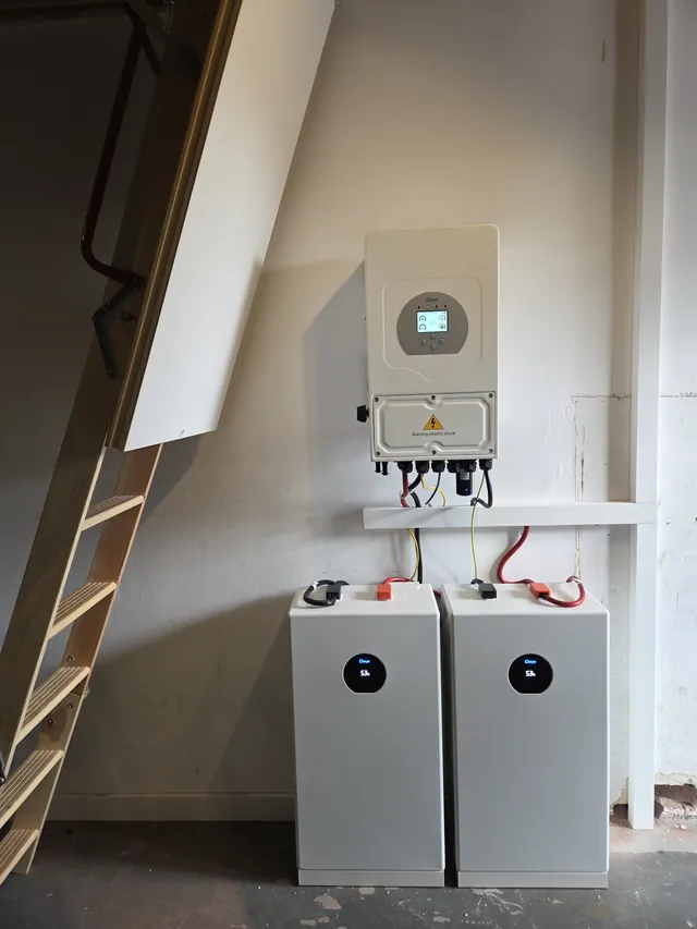 Deye inverter with two battery modules next to a loft ladder.